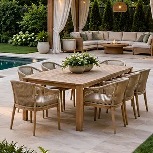Outdoor patio dining set with a rectangular wooden table and eight chairs, positioned on a stone terrace beside a swimming pool.