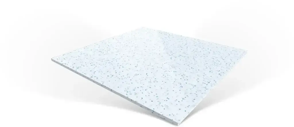 A square, white panel with a speckled pattern of small blue and grey dots.