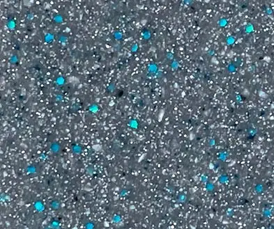Grey speckled aggregate finish with embedded bright blue accents.