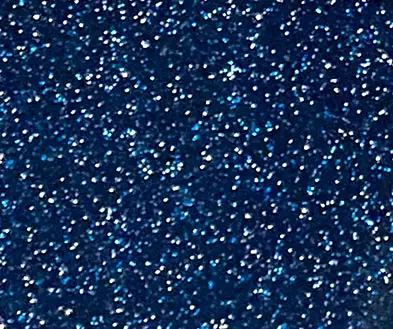Close-up of a dark blue, glittery surface.