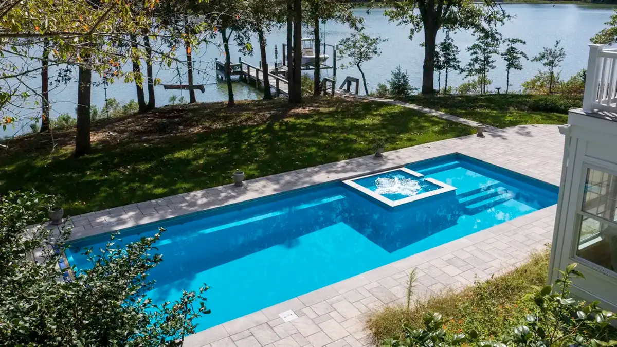 The Exquisite contemporary rectangular pool with a central spa